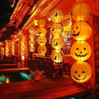 Two 8 inch paper Halloween pumpkin jack-o-lantern lanterns