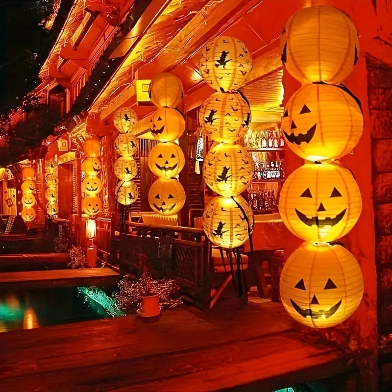 Two 8 inch paper Halloween pumpkin jack-o-lantern lanterns
