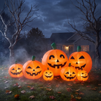 7ft Halloween inflatable pumpkins glowing on a front lawn at night, connected light-up jack-o-lanterns yard decoration