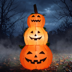 4ft Halloween inflatable stacked pumpkin tower glowing on a front lawn at night light-up jack-o-lanterns
