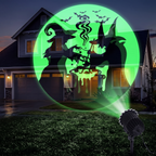 Halloween projector casting green witch and bat patterns across a house at night