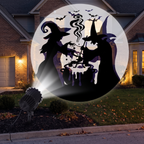 Halloween projector staked in a front yard projecting patterns onto a house at night