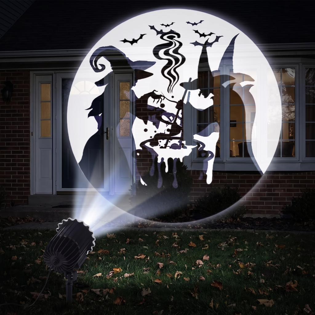 Halloween projector patterns projected onto a front window and door of a house at night