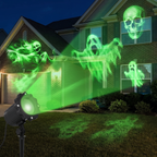 Halloween projector casting dynamic ghost and skull patterns on a house at night