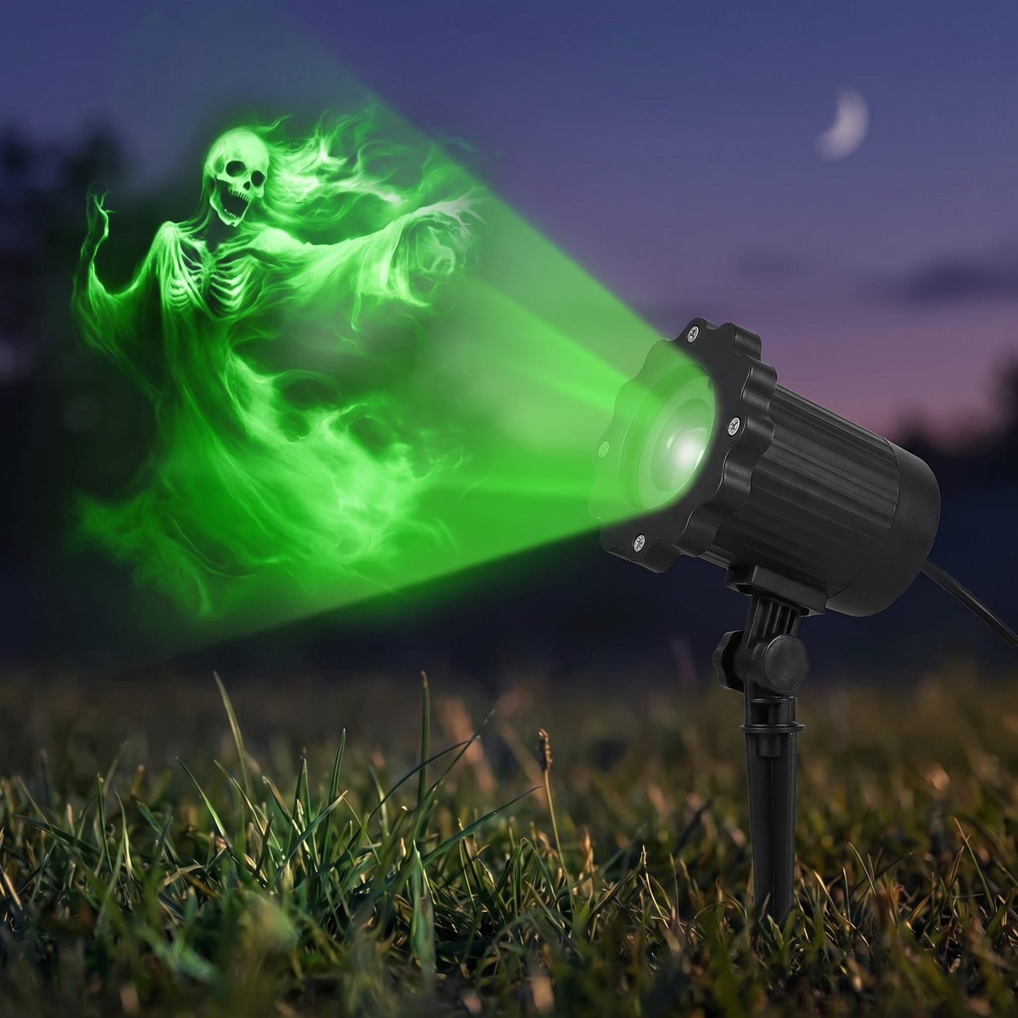 Close up of the compact Halloween ghost projector unit on a stake in grass