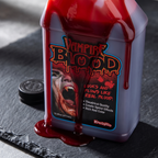 Close up of Halloween fake blood dripping down the bottle label
