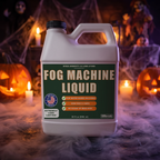 Fog machine liquid bottle with low-lying fog and Halloween decorations at night