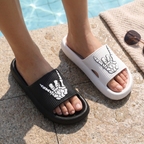 Feet wearing the skull hand slides