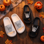 Skull hand slides styled on a floor with Halloween styling