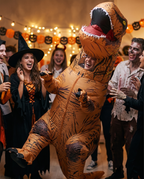 Person in T-Rex costume having fun at a Halloween party