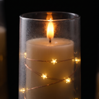 Close-up of star string lights inside the candle