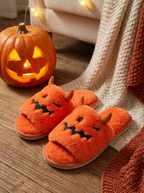 Slippers beside a jack-o-lantern