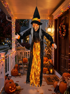 Hanging witch on a decorated porch